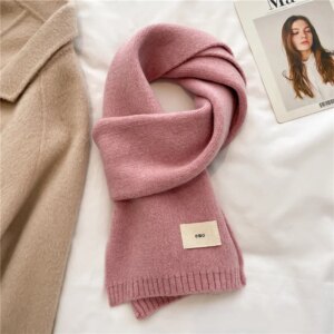 Echarpe en laine rose poudrée pour femme