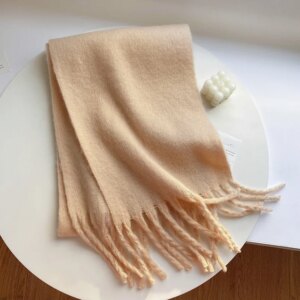Écharpe unie beige à franges en laine pour femme