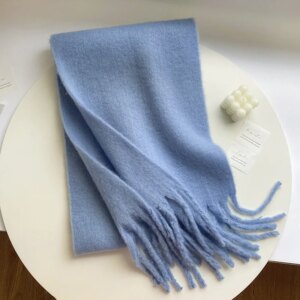 Écharpe longue unie bleue en laine à franges pour femme
