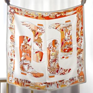 Foulard en soie imprime de motif bottes cowboy dans les tons orange